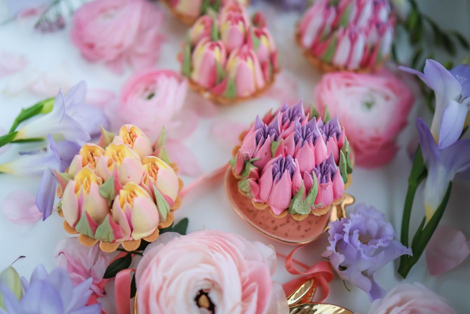 Bouquet de cupcakes pastel décorés de fleurs en crème au beurre